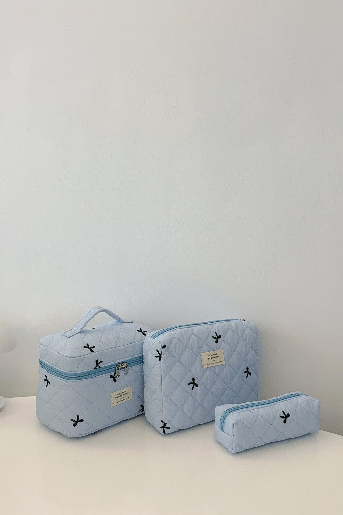 The Bella 3 Piece Bow Quilted Cloth Storage Bag Set